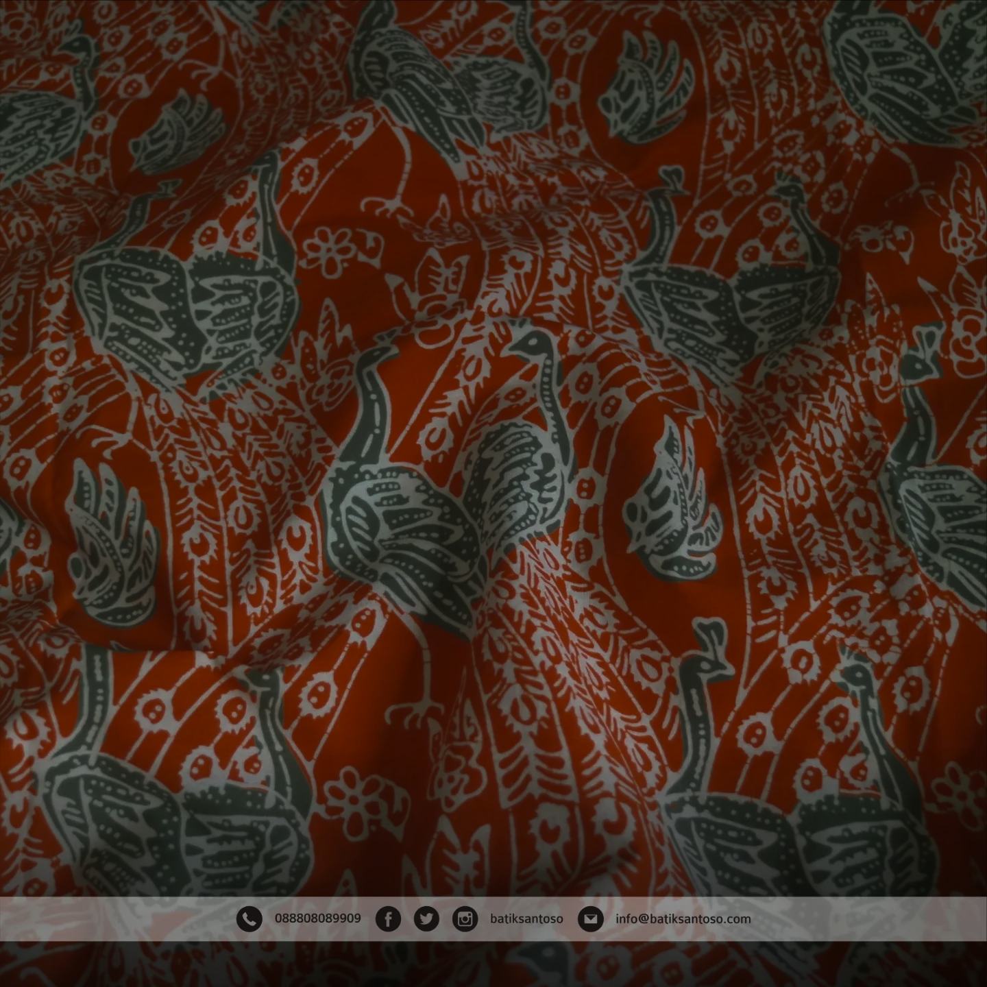 Tekstur kain batik motif merah oranye